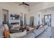 Modern living room with a fireplace, large TV, and comfortable seating at 12387 E Black Rock Rd, Scottsdale, AZ 85255