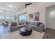 Relaxing living room with sectional sofa, coffee table, and fireplace at 12387 E Black Rock Rd, Scottsdale, AZ 85255