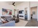Comfortable living room with sectional sofa, coffee table and fireplace at 12387 E Black Rock Rd, Scottsdale, AZ 85255