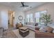 Relaxing living room with leather armchairs and a game table at 12387 E Black Rock Rd, Scottsdale, AZ 85255