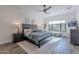 Main bedroom with a king-size bed, nightstands, and large window at 12387 E Black Rock Rd, Scottsdale, AZ 85255