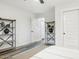 Well-lit bedroom with two closets and built-in shelving at 12938 W Seville Dr, Sun City West, AZ 85375