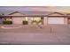 Brick ranch house with landscaped front yard and attached garage at 12938 W Seville Dr, Sun City West, AZ 85375