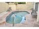 Relaxing kidney-shaped pool with flagstone patio and seating at 1314 E Helena Dr, Phoenix, AZ 85022