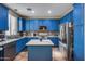 Bright kitchen with blue cabinets and a large island at 1323 E Frances Ln, Gilbert, AZ 85295