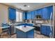 Modern kitchen with blue cabinets, stainless steel appliances, and an island at 1323 E Frances Ln, Gilbert, AZ 85295