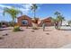 Well-maintained home with a large front yard and cacti at 14686 S Country Club Way, Arizona City, AZ 85123