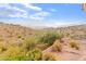 Landscaped backyard with mountain views and fire pit at 15414 E Westridge Dr, Fountain Hills, AZ 85268