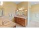 Bathroom features double sinks, wood cabinets, and tiled floors at 15414 E Westridge Dr, Fountain Hills, AZ 85268