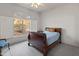 Bright bedroom with wood sleigh bed, window seat, and view at 15414 E Westridge Dr, Fountain Hills, AZ 85268