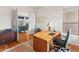 Home office with wood desk and views to the backyard at 15414 E Westridge Dr, Fountain Hills, AZ 85268