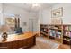 Home office with built-in shelves and hardwood floors at 15414 E Westridge Dr, Fountain Hills, AZ 85268