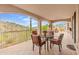 Covered patio with mountain views and seating for four at 15414 E Westridge Dr, Fountain Hills, AZ 85268