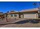 Single-story home with a two-car garage and desert landscaping at 16060 N Boulder Dr, Fountain Hills, AZ 85268