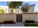 Private backyard with gated access and modern landscaping at 1717 E Morten Ave # 23, Phoenix, AZ 85020