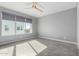 Spacious bedroom with gray walls and a ceiling fan at 1717 E Morten Ave # 23, Phoenix, AZ 85020