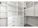 Large walk-in closet with built-in shelving and drawers at 1717 E Morten Ave # 23, Phoenix, AZ 85020