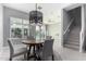 Bright dining area with round table and staircase view at 1717 E Morten Ave # 23, Phoenix, AZ 85020
