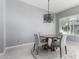 Modern dining area with a round table and four chairs at 1717 E Morten Ave # 23, Phoenix, AZ 85020