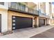 Modern garage with dark gray doors and stone exterior at 1717 E Morten Ave # 23, Phoenix, AZ 85020