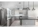 Modern kitchen with stainless steel appliances and island at 1717 E Morten Ave # 23, Phoenix, AZ 85020