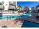 Community pool with spa and shaded seating area at 1717 E Morten Ave # 23, Phoenix, AZ 85020