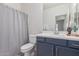 Clean bathroom with a toilet, vanity, and shower/tub combo at 17937 W Cedarwood Ln, Goodyear, AZ 85338