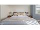 Bright bedroom with king-size bed, neutral decor, and window at 17937 W Cedarwood Ln, Goodyear, AZ 85338