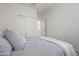 Spacious bedroom with sliding door closet and window with shutters at 17937 W Cedarwood Ln, Goodyear, AZ 85338