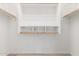 Large walk-in closet with double hanging rods and shelving at 17937 W Cedarwood Ln, Goodyear, AZ 85338