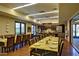 Community dining room with tables, chairs, and a kitchen at 17937 W Cedarwood Ln, Goodyear, AZ 85338