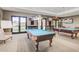 Game room featuring two billiard tables and a relaxing seating area at 17937 W Cedarwood Ln, Goodyear, AZ 85338