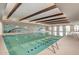 Indoor swimming pool with seating and a relaxing atmosphere at 17937 W Cedarwood Ln, Goodyear, AZ 85338
