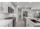 Modern kitchen with white cabinets, stainless steel appliances, and a large island at 17937 W Cedarwood Ln, Goodyear, AZ 85338
