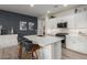 Modern kitchen with white cabinets, stainless steel appliances, and an island at 17937 W Cedarwood Ln, Goodyear, AZ 85338