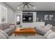 Spacious living room with built-in entertainment center and comfortable seating at 17937 W Cedarwood Ln, Goodyear, AZ 85338