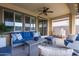Relaxing covered patio with seating area and ceiling fan at 17937 W Cedarwood Ln, Goodyear, AZ 85338