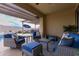 Outdoor patio with seating area, providing access to the pool at 17937 W Cedarwood Ln, Goodyear, AZ 85338