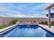 Relaxing pool area, waterfall, and putting green at 17937 W Cedarwood Ln, Goodyear, AZ 85338