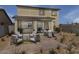 Entertain in the backyard with stylish patio furniture and BBQ, perfect for outdoor gatherings and relaxation at 18245 W Papago St, Goodyear, AZ 85338