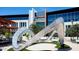 Modern building with a unique metal sculpture in the plaza at 18245 W Papago St, Goodyear, AZ 85338