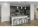 Modern kitchen featuring dark cabinetry and granite countertops at 18245 W Papago St, Goodyear, AZ 85338