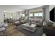 Spacious living room with light wood floors and comfy seating at 18245 W Papago St, Goodyear, AZ 85338