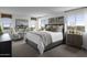 Bright main bedroom with plush bed and sitting area at 18245 W Papago St, Goodyear, AZ 85338