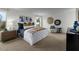 Serene main bedroom featuring neutral tones, decorative wall art, and generous natural light at 18251 W Papago St, Goodyear, AZ 85338