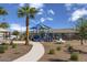 Modern playground with shade structures and walking path at 18251 W Papago St, Goodyear, AZ 85338