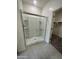 Large bathroom with a walk-in shower and built-in shelving at 1907 E Harness Ln, San Tan Valley, AZ 85140