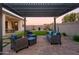 Pergola-covered patio with seating area and view of backyard at 19213 W Missouri Ave, Litchfield Park, AZ 85340