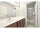 Bathroom with single vanity and shower/tub combo at 19912 N Toledo Ave, Maricopa, AZ 85138