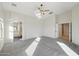 Spacious Primary bedroom with plush carpet and multiple access points at 19912 N Toledo Ave, Maricopa, AZ 85138